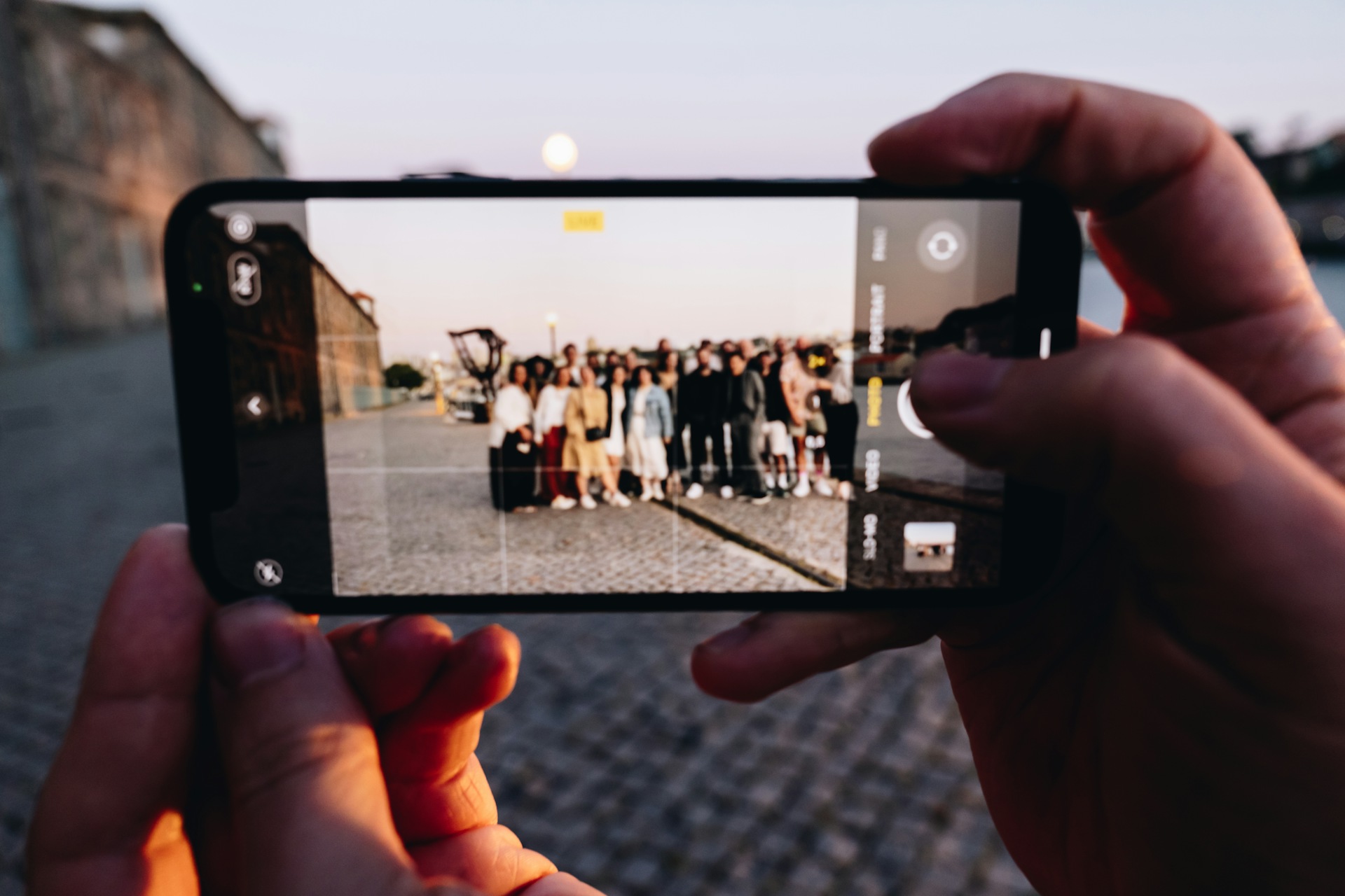 picture of a group photo been taking with a phone at Sketch meetup